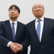 Nintendo’s next president Shuntaro Furukawa (left) shakes hands with current president Tatsumi Kimishima in Osaka on April 26.